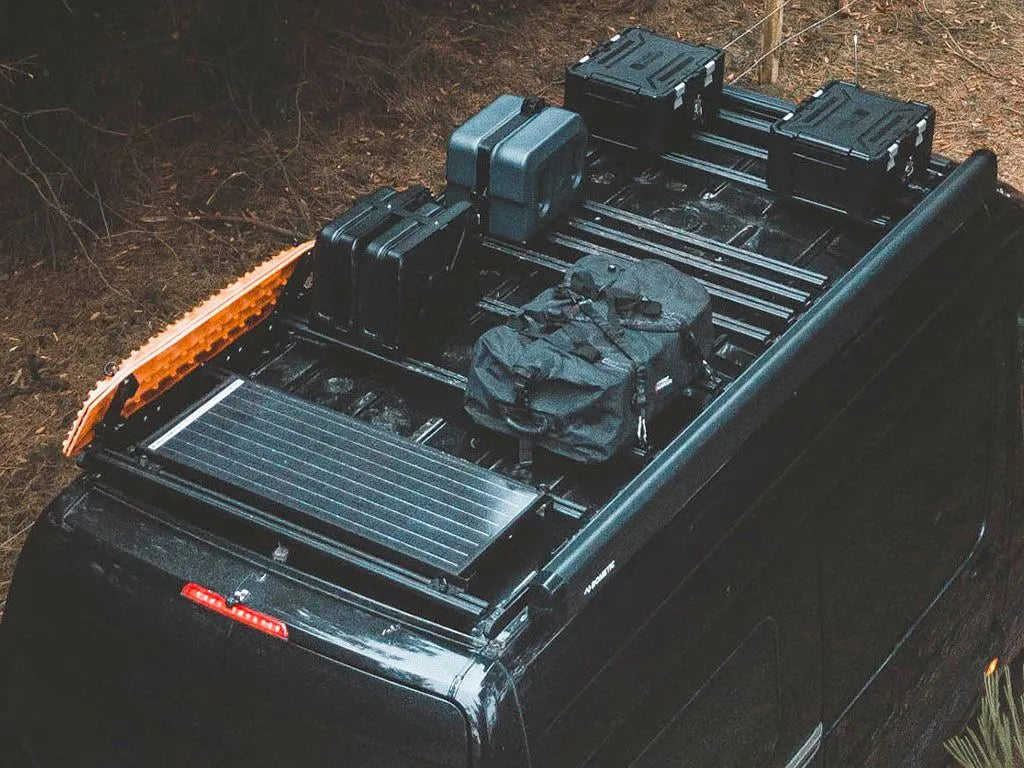 Black off-road vehicle with cargo on a natural background